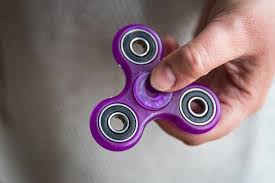 Fidget spinner helping a human relieve stress