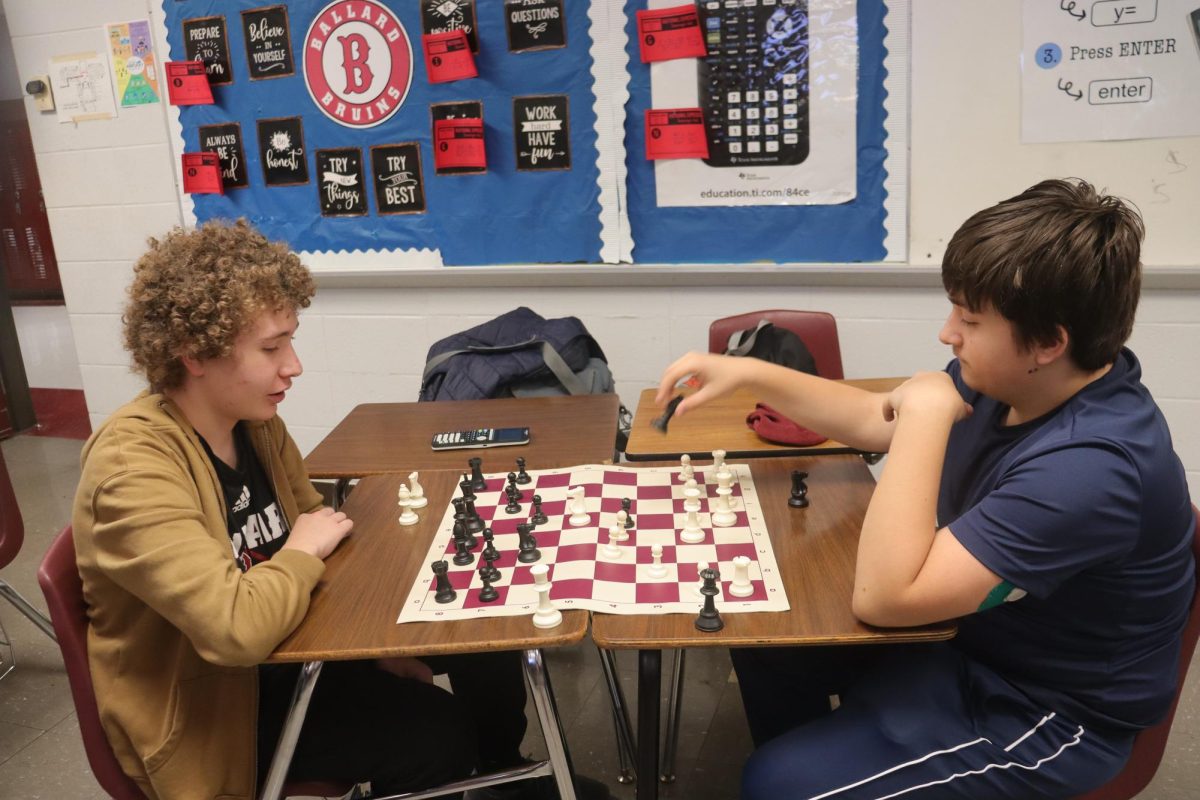 Chess club team members playing chess
